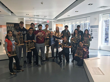 students holding angklung instruments